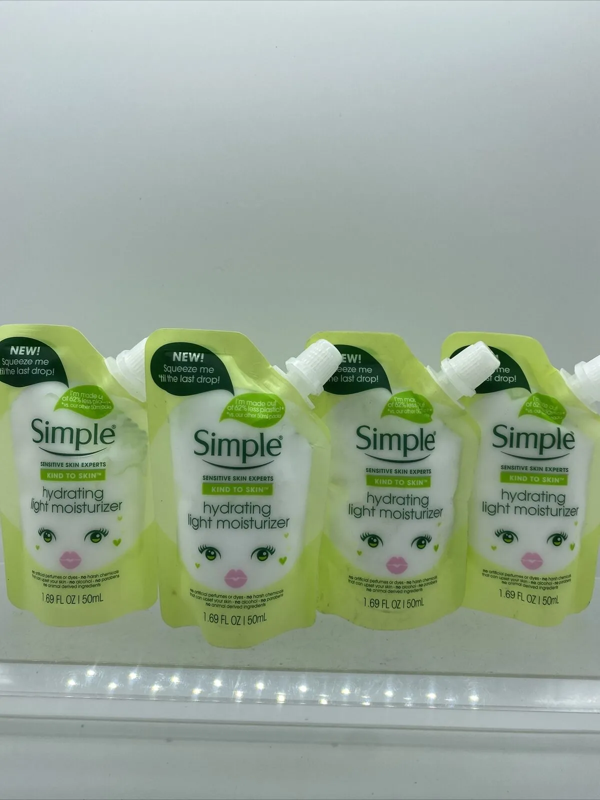 (4) Simple Hydrating Light Moisturizer Squeeze Me Pouches 1.69oz Travel Lotion